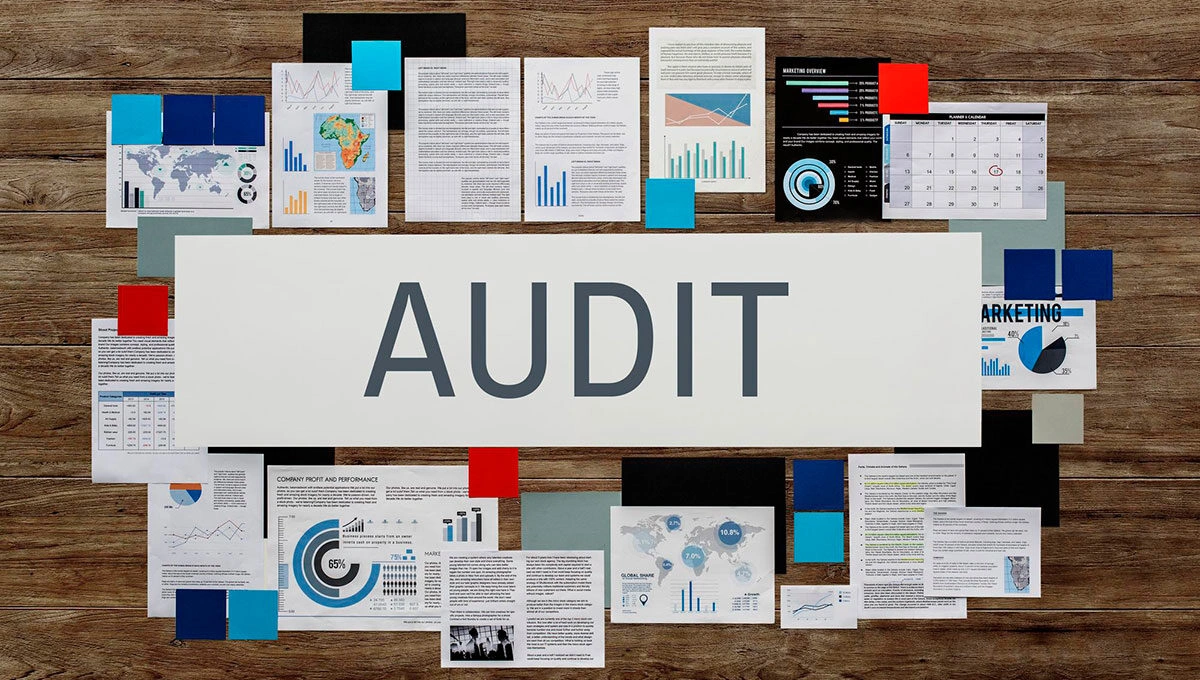 Audit documents, reports and charts arranged for review